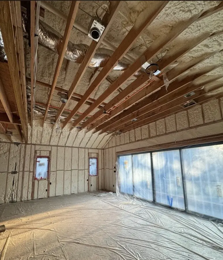 Interior walls and ceiling insulated with spray foam during new construction in Shelburne